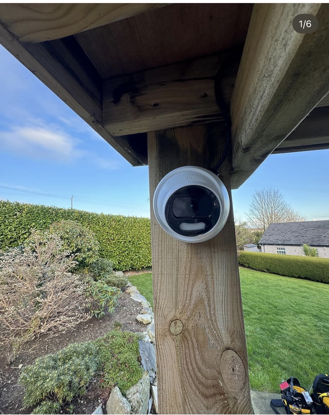 Smart CCTV turret camera neatly mounted to a timber pergola post covering the garden of a Newcastle home